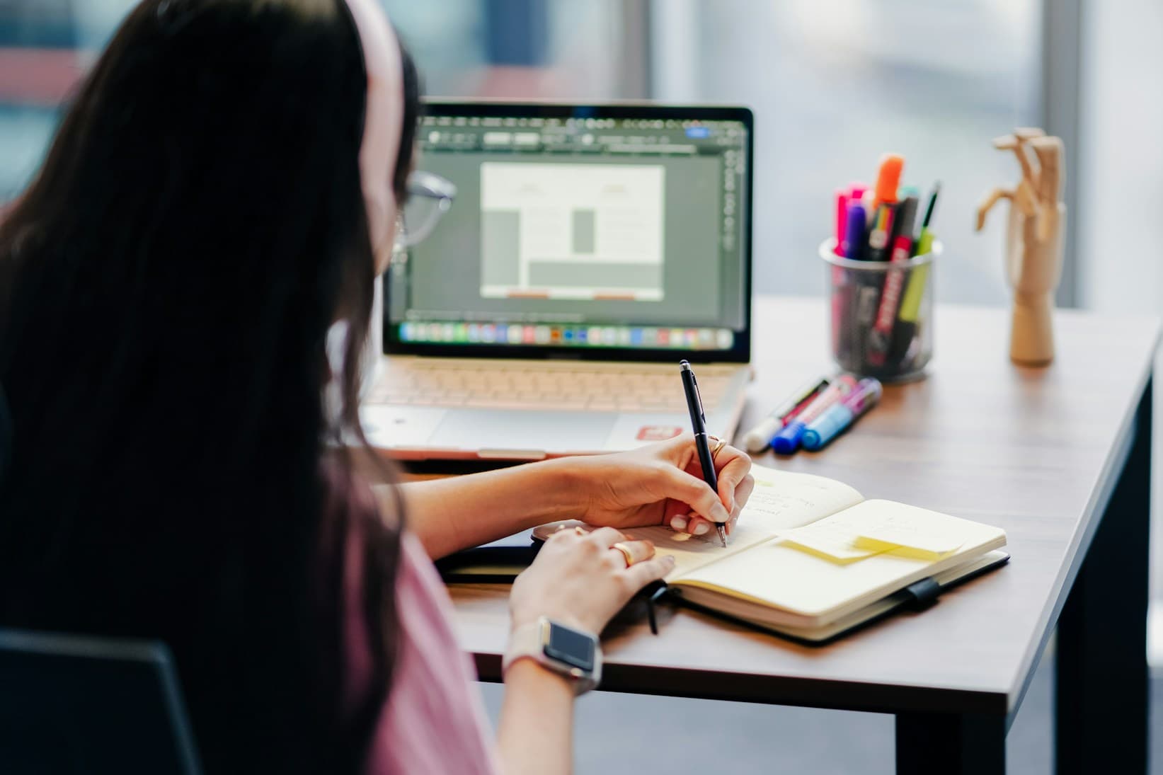 Learning workspace with a desktop computer and study materials